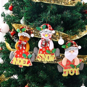Detailed view of plush reindeer and Santa Christmas tree ornaments with bells and sequins
