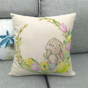 Close-up of Easter rabbit and floral wreath print on linen texture throw pillow cover
