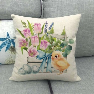 Easter linen pillowcase with colorful tulips, eggs and chick print on grey sofa