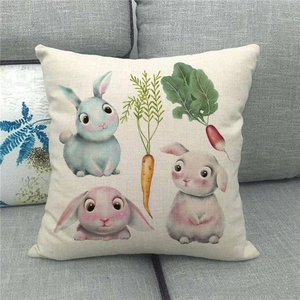 Easter decorative linen pillowcase featuring cute cartoon rabbits and carrots on a sofa