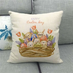 Close-up of Happy Easter linen pillowcase with rabbit basket on a cozy grey sofa