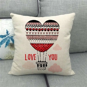 Close-up of linen cushion cover featuring heart hot air balloon and Love You text