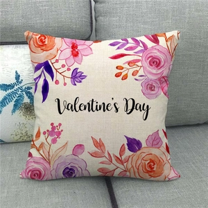 Close-up of linen pillow cover with floral watercolor design and Valentine's Day text