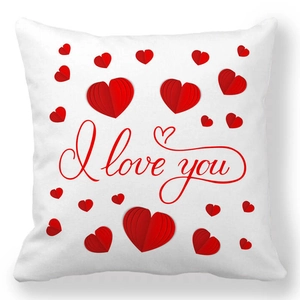 Detail of white Valentine's Day pillowcase featuring red hearts and I love you script