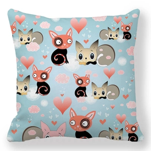Detail of square pillowcase with cartoon cats and pink hearts on a light blue background