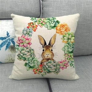 Detail view of linen fabric texture with a rabbit and succulent plants floral pattern