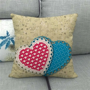 Close-up of linen Valentine's Day pillowcase with LOVE print and lace heart appliques
