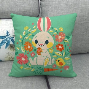 Detail of mint green linen pillowcase featuring Easter bunny and egg illustrations