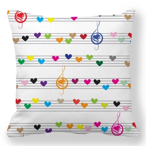 Detail of colorful music notes shaped as hearts on a white peach skin pillowcase