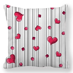 Detail of square pillowcase with grey vertical stripes and hand-drawn red hearts