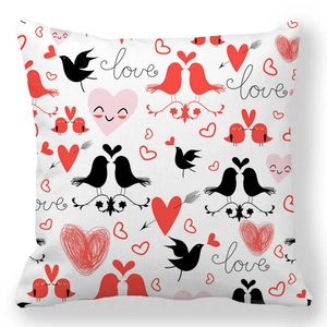Detail of peach skin pillowcase with romantic lovebirds and red heart patterns