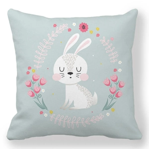 Detailed view of soft peach skin pillowcase with floral wreath and cute bunny illustration