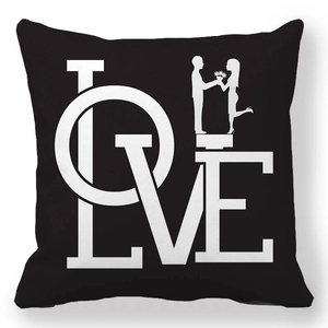 Macro shot of black peach skin pillowcase featuring white LOVE and couple silhouette