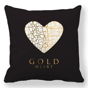 Detail of black square pillowcase featuring a gold cracked heart and Gold Heart text