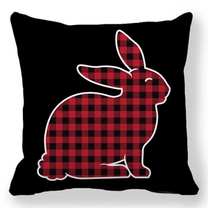 Detailed texture of black pillowcase featuring a red and black buffalo plaid bunny silhouette