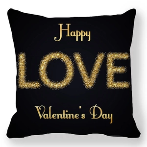 Close-up of black square pillowcase with gold glitter LOVE and Happy Valentine's Day text