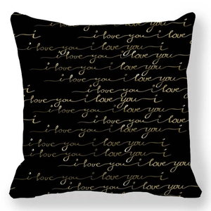 Detail of black peach skin cushion cover with golden 'i love you' calligraphy print