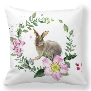 Detailed close-up of watercolor brown rabbit and pink flower wreath on square pillowcase