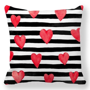 Square pillowcase featuring black and white horizontal stripes with red watercolor hearts