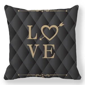 Macro view of argyle pattern fabric and golden LOVE text on decorative pillowcase