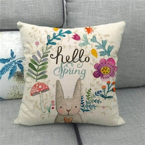 Linen pillow cover with 'hello Spring' text, brown rabbit, and floral garden illustration