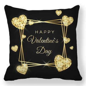 Close-up of Happy Valentine's Day gold glitter hearts on black square pillowcase