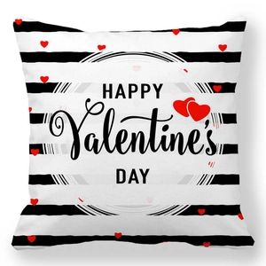 Close-up of peach skin pillowcase with black stripes and red hearts for Valentine's Day