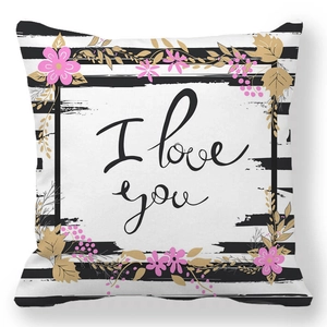 Detail of peach skin pillowcase featuring I love you script and floral accents