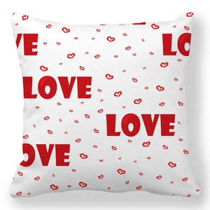 Detail of square peach skin pillowcase with red LOVE letters and heart patterns