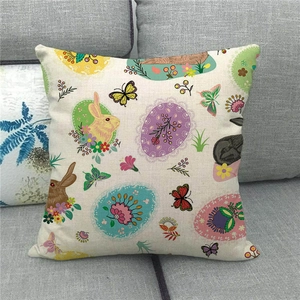 Detail of linen Easter pillow cover with cartoon rabbit and floral eggs on a sofa