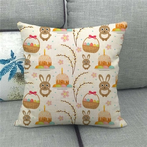 Detail of linen Easter pillow cover with bunny and eggs on a grey fabric sofa