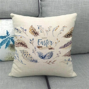 Detailed texture of linen Easter pillow cover featuring feathers and festive typography