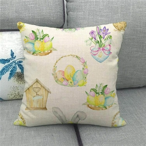 Close-up of Easter linen pillowcase with watercolor bunny and eggs on a sofa