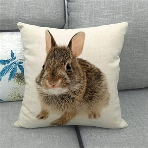 Linen texture detail of square Easter pillowcase featuring realistic brown rabbit print