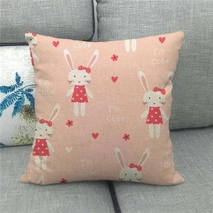 Detail of pink linen pillowcase with cute cartoon rabbit pattern and I'm Cute text