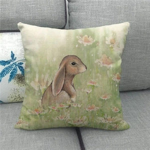 Close-up of linen pillowcase featuring a realistic brown rabbit among white spring flowers