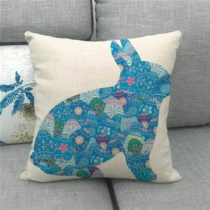 Close-up of linen Easter bunny pillowcase with colorful floral pattern and GOOD print