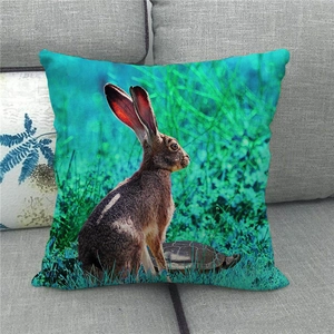 Linen Easter pillow cover with realistic rabbit and turtle print on a grey sofa