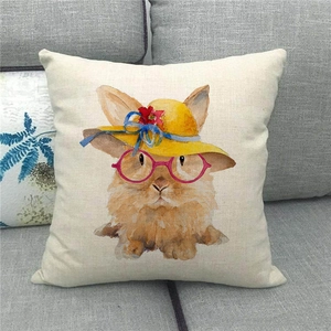 Close-up of Easter bunny linen pillowcase featuring watercolor rabbit and straw hat