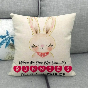 Detailed close-up of a linen Easter pillow cover featuring a cute bunny design on a sofa