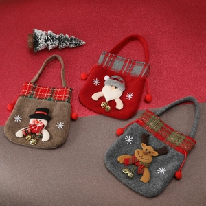 Close-up of Christmas gift bags featuring felt Santa, snowman, and reindeer characters