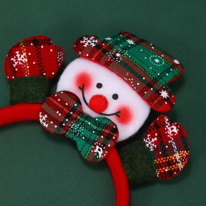 Detail of Christmas headband featuring snowman with gloves and festive red green colors