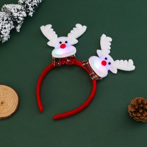 Glow-in-the-dark Christmas headband featuring plush reindeer with colorful LED lights