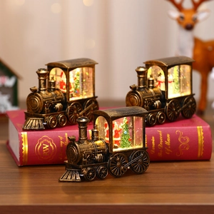 Vintage bronze Christmas train lanterns with glowing LED light and festive figurines