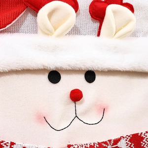 Detail of Christmas chair cover showing felt material with Santa face and faux fur trim