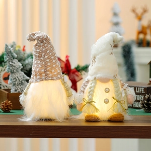 Lighted Christmas Gnomes plush with warm LED lights and cozy knit hats on wooden table