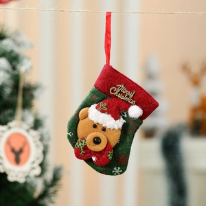 Detail of Christmas stocking ornament with 3D teddy bear and gold Merry Christmas text