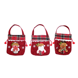 Three Christmas gift bags with Santa, snowman, reindeer plush figures and red jute texture