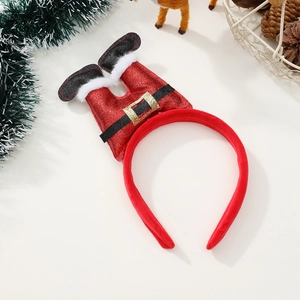 Détail d'un serre-tête de Noël avec jambes de Père Noël en paillettes rouges et bordure blanche