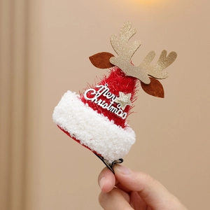 Christmas reindeer antler hair clip with plush red hat and Merry Christmas text